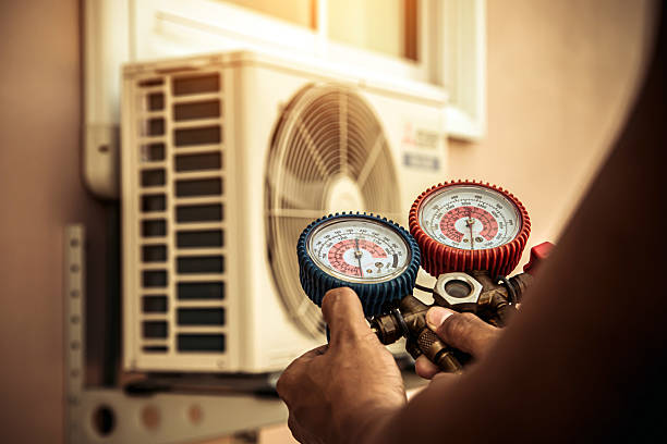 Professional Heat Pump Repair technician working in North Vernon, IN